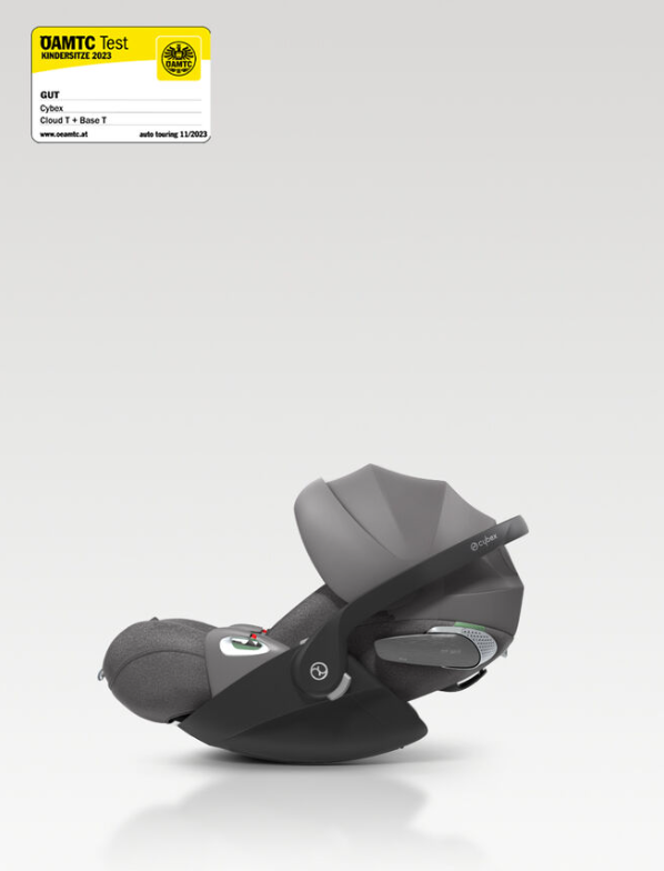 A side profile view of a grey and black Cybex baby car seat on a light grey gradient background, with a DAMTC Test Germany Pass certification sticker in the top left corner.